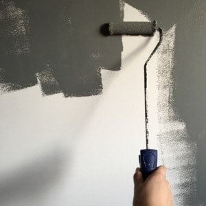 Painting gray wall - Home repairs before selling your home by Goal Line Moving of MN